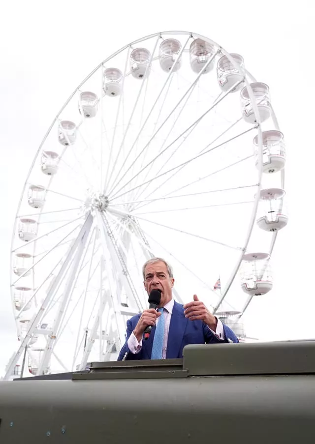 Nigel Farage in front of a Ferris wheel