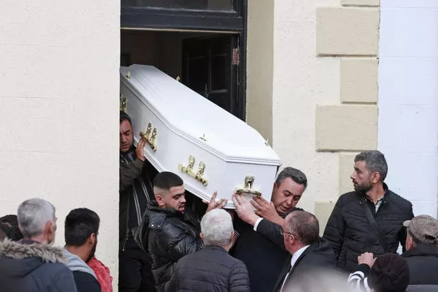 The coffin carrying the remains of Dlava Mohamed is carried out of the family home in Clones, Co Monaghan