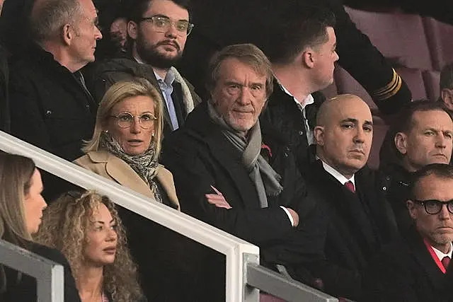 Sir Jim Ratcliffe, centre, watches the action at Old Trafford