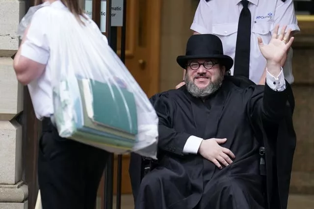 Nicholas Rossi departing Edinburgh Sheriff and Justice of the Peace Court last July