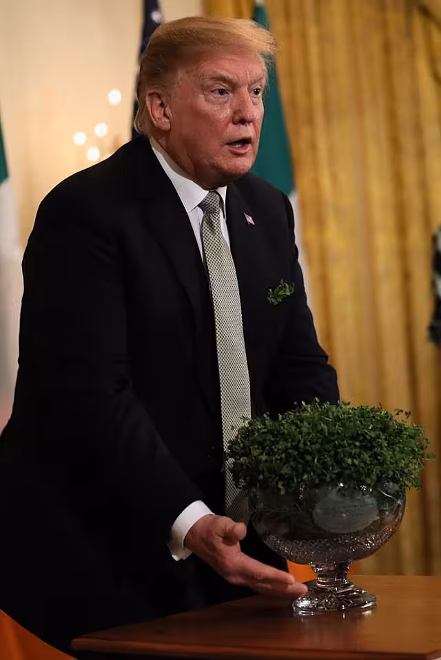 US president Donald Trump with a bowl of shamrock, presented by taoiseach Leo Varadkar, in 2019