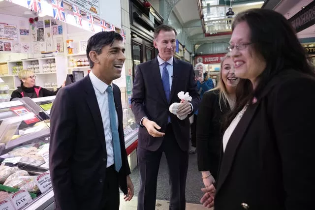 Prime Minister Rishi Sunak, left, and Chancellor Jeremy Hunt during a community project visit to Accrington Market Hall in Lancashire 