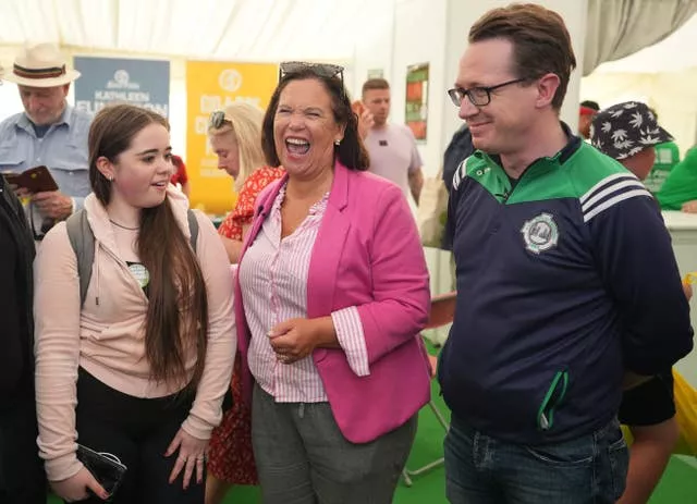 Mary Lou McDonald in pink jacket among people at the National Ploughing Championships 2024