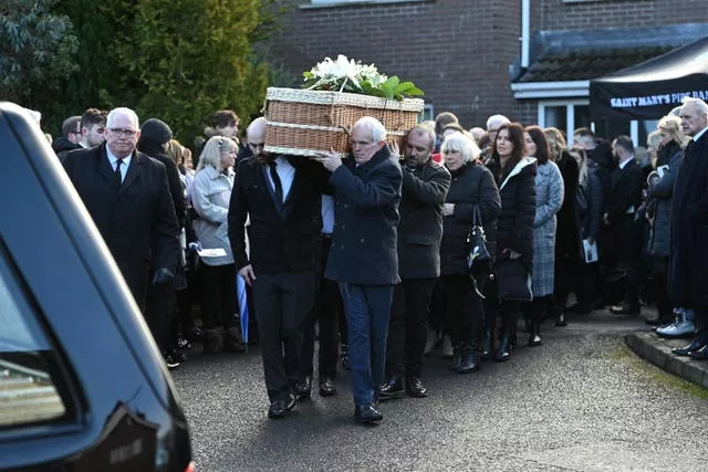 Family members carry the casket of murder victim Natalie McNally following her funeral service at her parents' home in Lurgan in Co Armagh