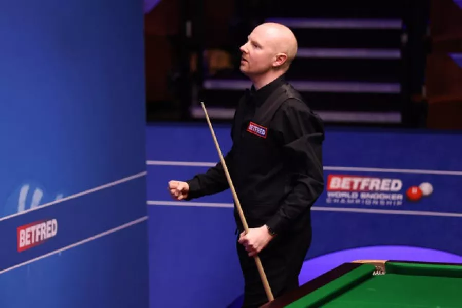 Anthony McGill celebrates victory over world champion Ronnie O'Sullivan at the Crucible