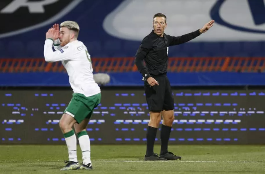 Republic of Ireland striker Aaron Connolly reacts to referee Davide Massa's decision not to award him a penalty in Belgrade