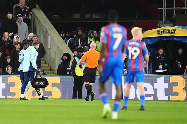 Bukayo Saka heads towards the tunnel after sustaining a hamstring injury