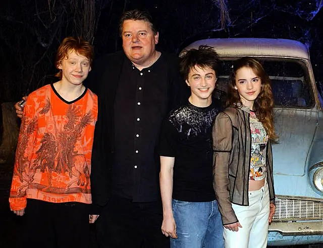 The stars of Harry Potter And The Chamber Of Secrets, from left to right; Rupert Grint, Robbie Coltrane, Daniel Radcliffe Emma Watson, during the worldwide launch of the DVD/VHS at Leavesden Studios in north London on April 8 2003 