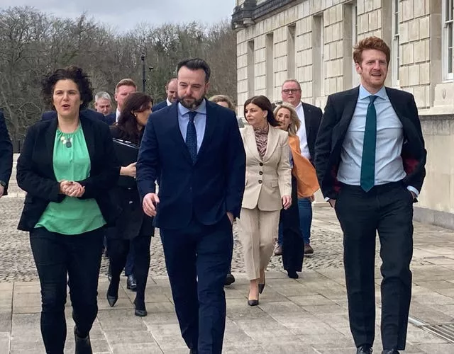 SDLP leader Colum Eastwood (centre), with South Belfast candidate Claire Hanna (left), and Opposition leader Matthew O’Toole at Stormont 