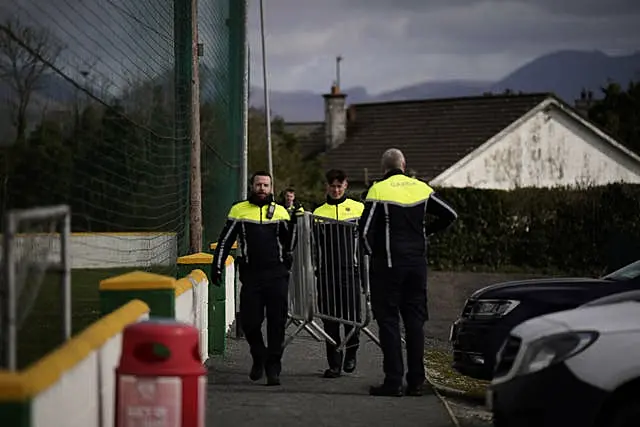 A garda security cordon is put into place at Cooley Kickhams GAA Club