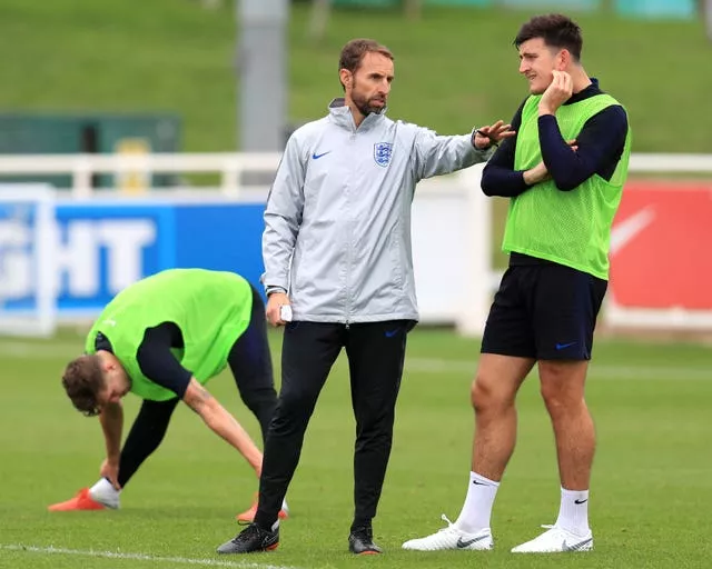 England’s Gareth Southgate and Harry Maguire
