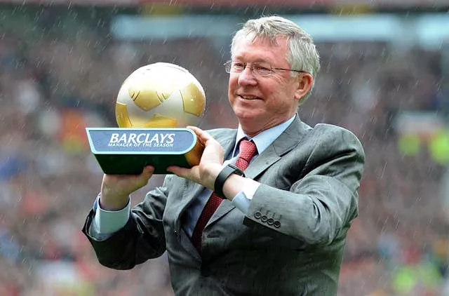 Sir Alex Ferguson collects the Premier League manager of the year trophy for 2010-11