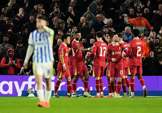 Cody Gakpo, centre left, celebrates scoring Liverpool's first against Brighton