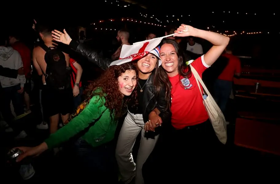 England fans at the Vinegar Yard in London Bridge celebrate reaching the Euro 2020 final