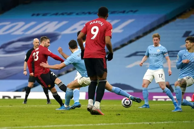 Luke Shaw, left, scores Manchester United’s second goal in their March 2021 win at the Etihad Stadium