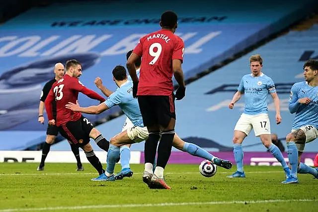 Luke Shaw, left, scores Manchester United’s second goal in their March 2021 win at the Etihad Stadium