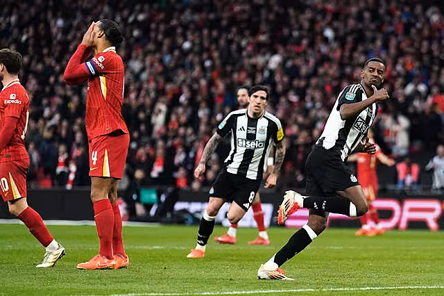 Alexander Isak celebrates as Virgil van Dijk covers his face
