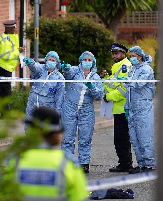 Forensic investigators in Laing Close in Hainault, north east London