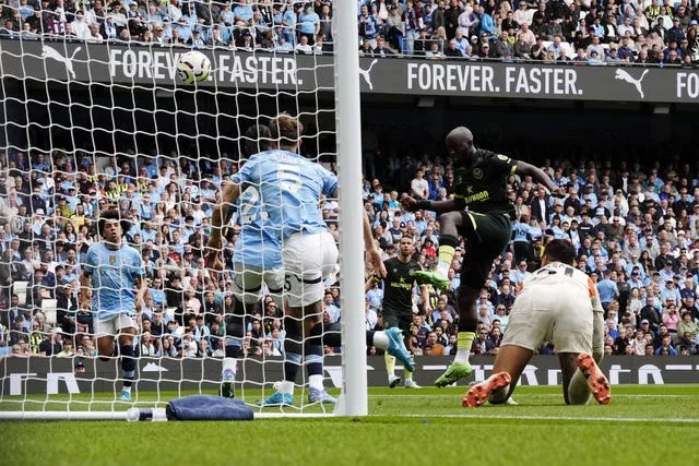 Brentford’s Yoane Wissa heads the opening goal against Manchester City on Saturday