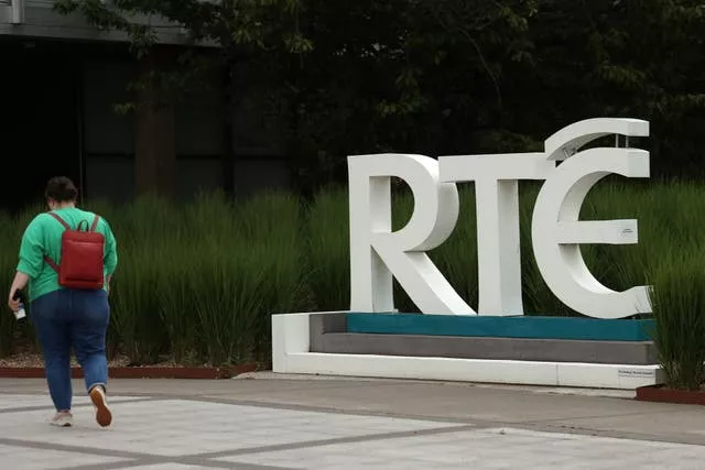 RTE logo with a woman walking by