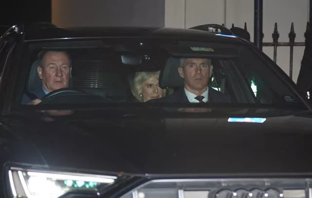Camilla leaving the hospital in a car