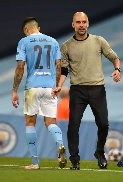 Cancelo (left) needed time to adapt to Pep Guardiola's style