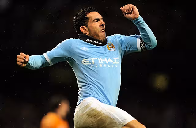 Manchester City's Carlos Tevez celebrates after scoring against Wolves in 2011