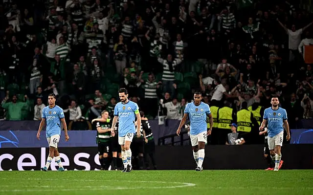 Manchester City players look dejected after conceding to Sporting Lisbon