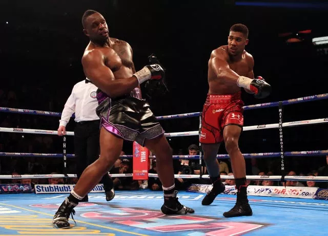 Anthony Joshua, right, stopped Dillian Whyte eight years ago (Nick Potts/PA)
