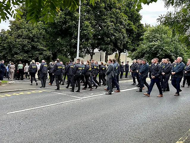 A Garda guard of honour as the coffin of Detective Garda Deirdre (Dee) Finn is carried into St John the Evangelist church in Ballinteer, Co Dublin