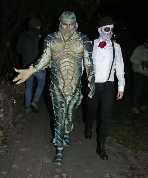 Alan Carr (left) and his husband Paul Drayton leaving a Halloween party hosted by Jonathan Ross 
