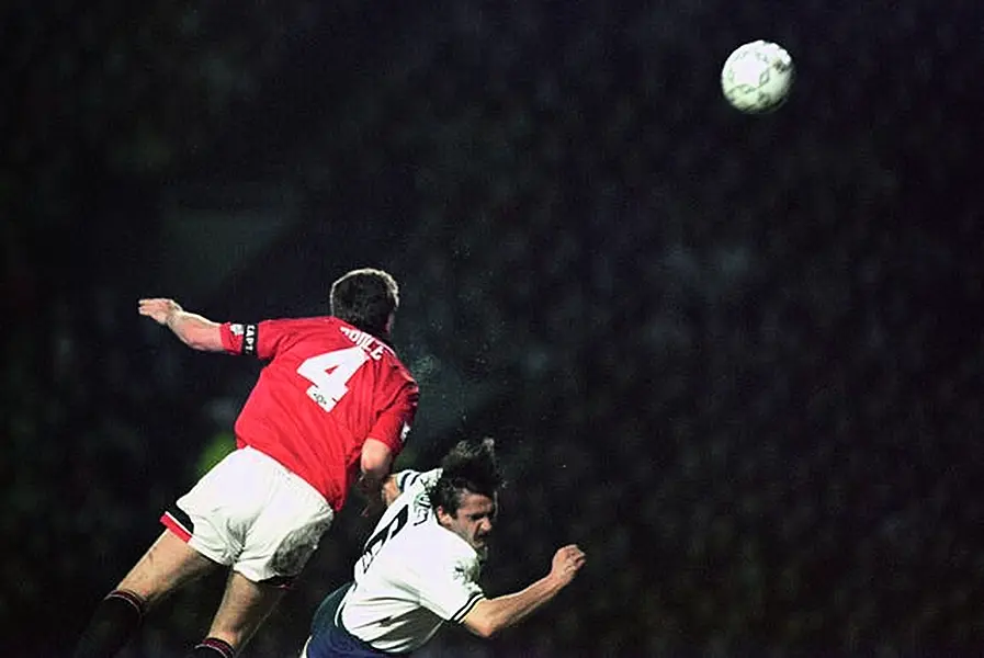 Steve Bruce heads the ball clear during his playing career