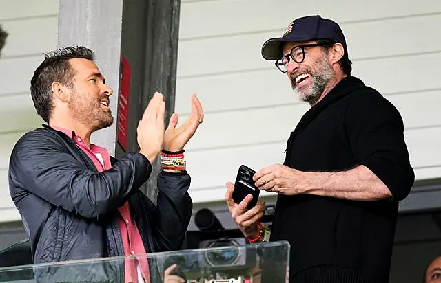 Wrexham co-owner Ryan Reynolds (left) and Hugh Jackman in the stands before the Sky Bet League Two match against MK Dons