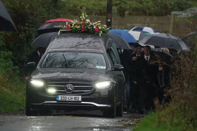 The procession for Denise Morgan arrives at her funeral