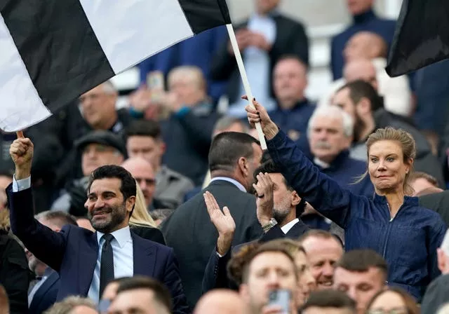 Newcastle United chairman Yasir Al-Rumayyan (centre) and directors Amanda Staveley (right) and Mehrdad Ghodoussi (left) among the crowd at St James' Park