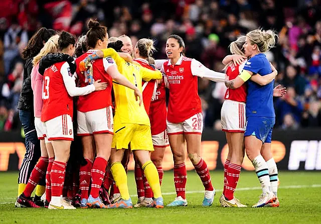 England team-mates Leah Williamson of Arsenal and Chelsea’s Millie Bright embrace at the end as Arsenal players celebrate 