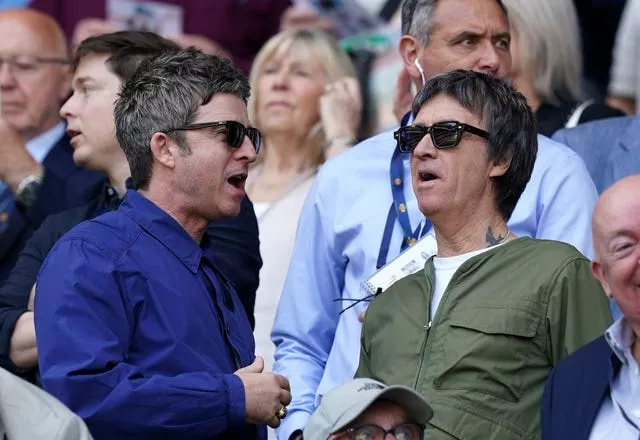 Noel Gallagher (left) and Johnny Marr in the stands before a Premier League match at the Etihad Stadium, Manchester, in May 2024