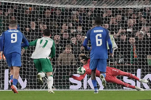 Republic of Ireland goalkeeper Caoimhin Kelleher (centre) saves Finland striker Joel Pohjanpalo's penalty