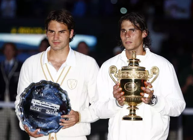 Nadal (right) won his first Wimbledon title in an epic final against Roger Federer 