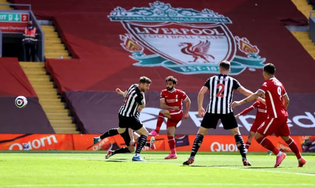 Mohamed Salah, centre left, scores Liverpool's goal against Newcastle