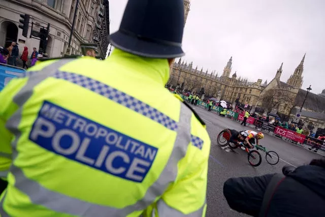 A police presence during the wheelchair race as it passes Big Ben