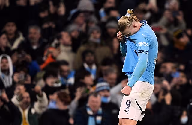 Erling Haaland kisses the Manchester City badge to celebrate his second goal against Real Madrid