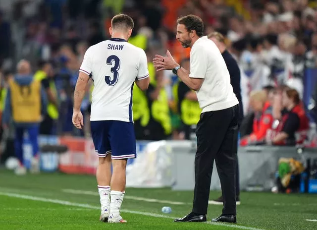 England manager Gareth Southgate (right) addresses Luke Shaw on the touchline during the Euro 2024 semi-final