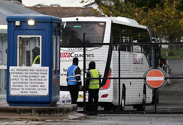 A coach arrives at the Manston immigration short-term holding facility located at the former Defence Fire Training and Development Centre in Thanet, Kent