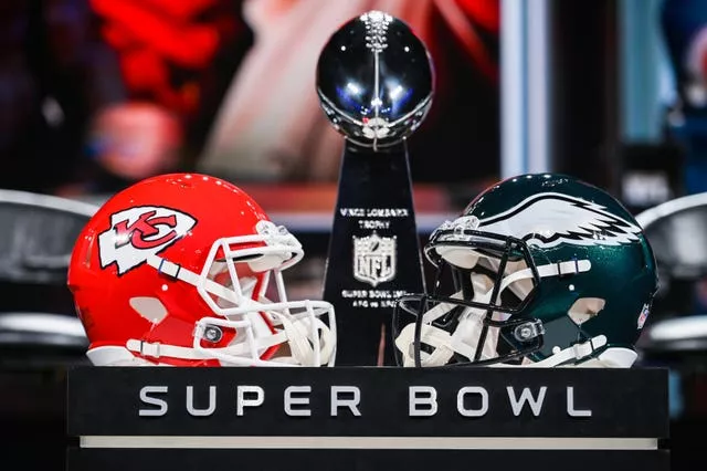 Super Bowl LVII publicity shot with Kansas City Chiefs and Philadelphia Eagles helmets