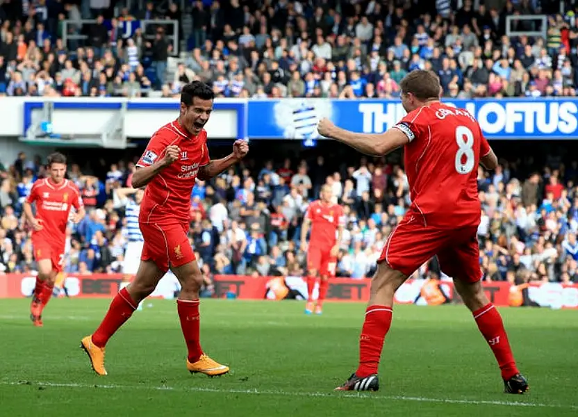 Philippe Coutinho (left) celebrates scoring for Liverpool