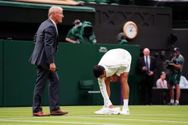 Novak Djokovic was desperate to ensure the Centre Court surface was dry after a brisk shower