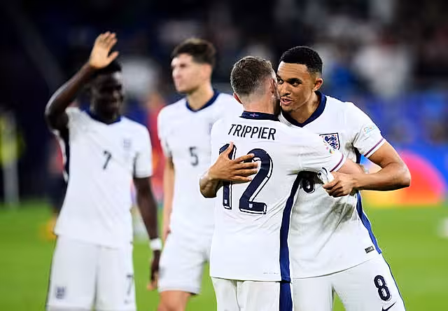 England’s Kieran Trippier hugs team-mate Trent Alexander-Arnold