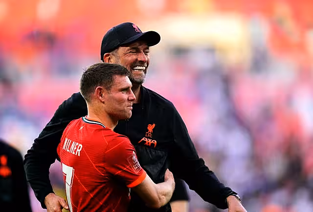 Jurgen Klopp hugs James Milner