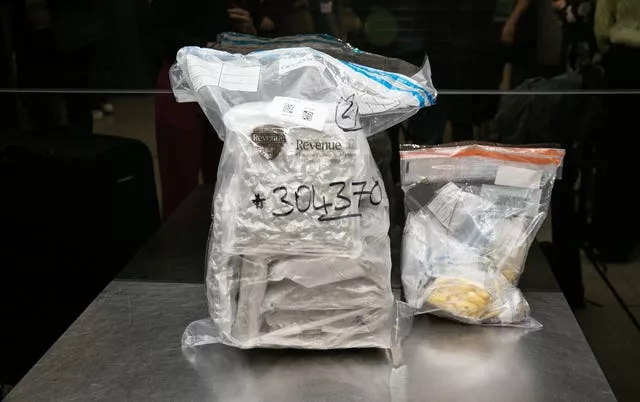 Two large plastic bags containing seized drugs